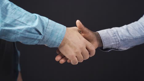 Close-up-handshake-of-african-man-and-white-man.-Agreed,-greet,-meet.